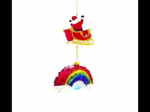 Caprichoso Papá Noel en trineo sobre el arco iris - Adorno navideño de vidrio soplado