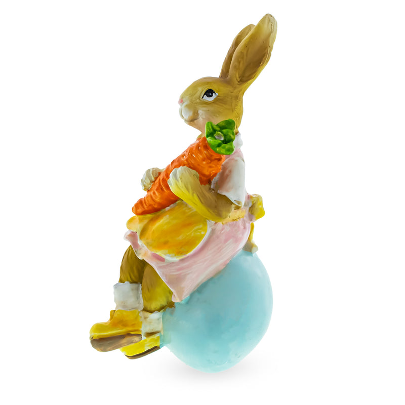 Mother Bunny Holding Carrot and Sitting on the Easter Egg Figurine